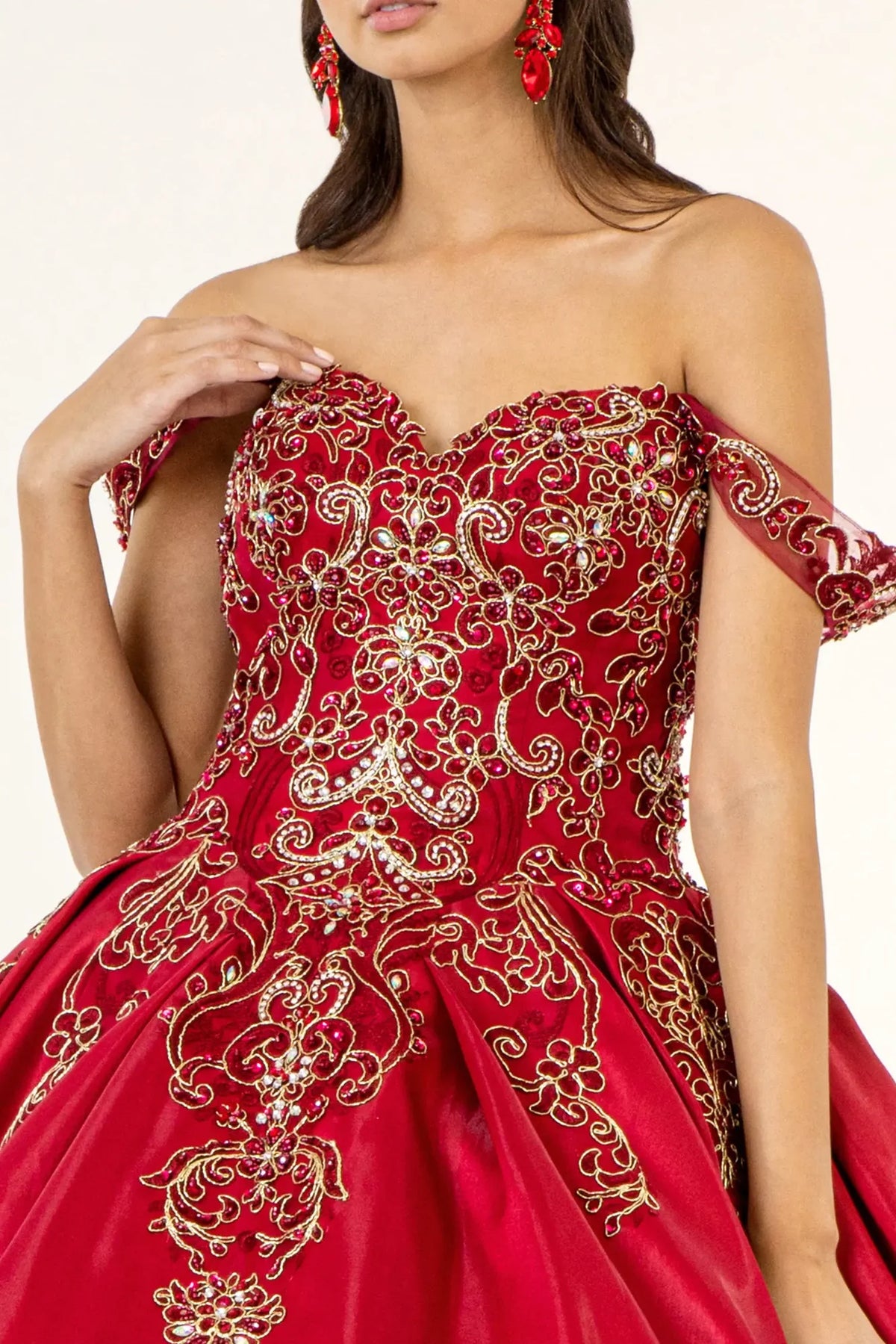 Bodice close-up highlights the Burgundy quinceañera ball gown with convertible shoulder straps.