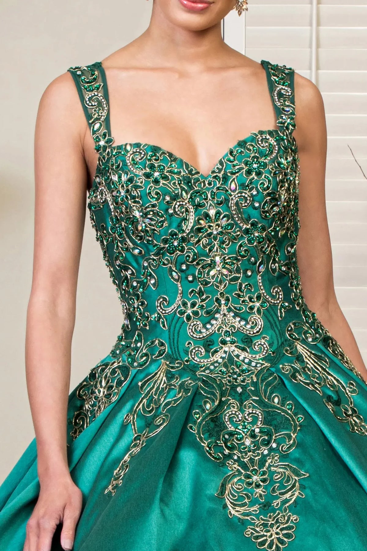 Bodice close-up highlights the Green quinceañera ball gown with convertible shoulder straps.