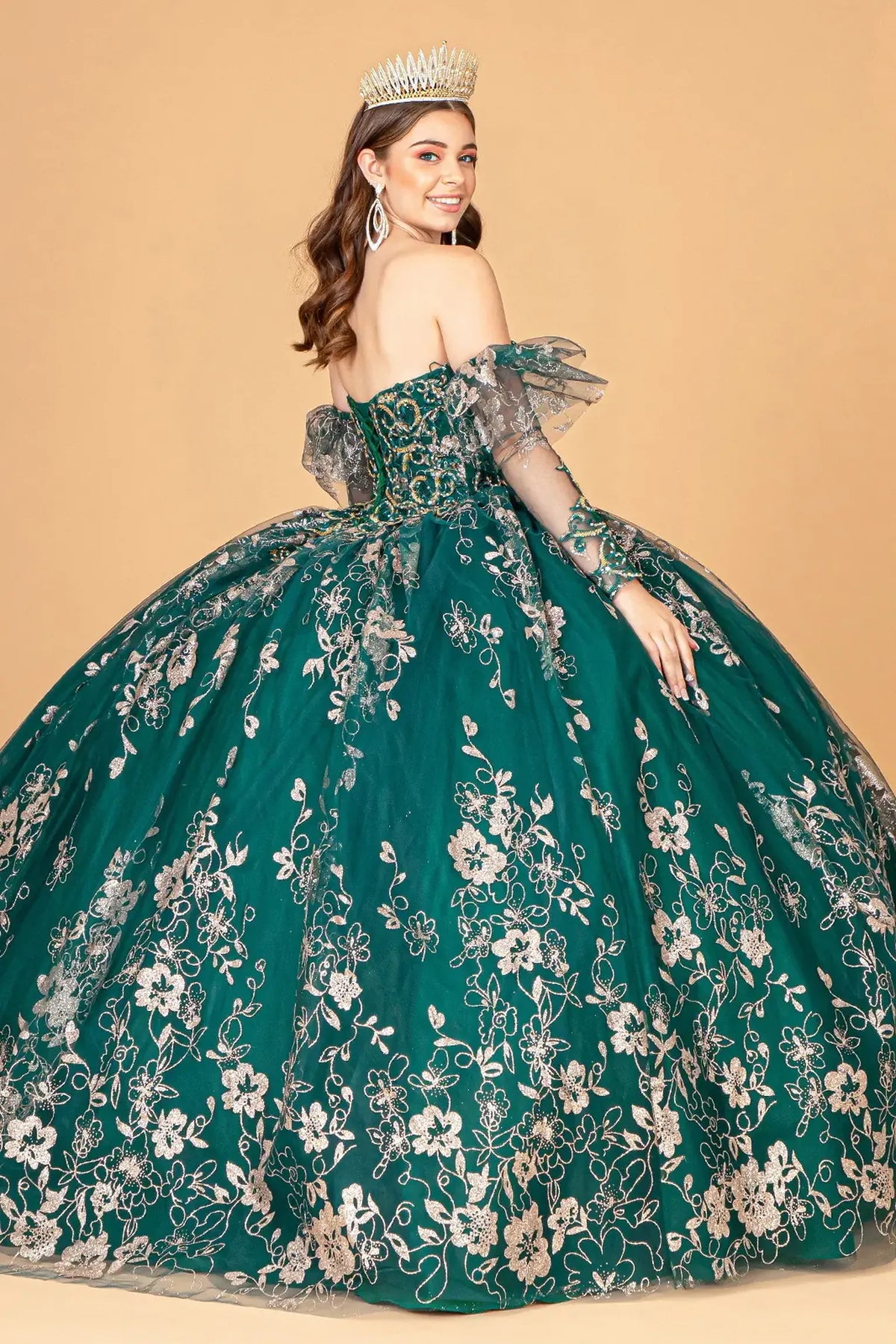 Bodice close-up highlights the Emerald Green quinceañera ball gown with glitter embroidery.