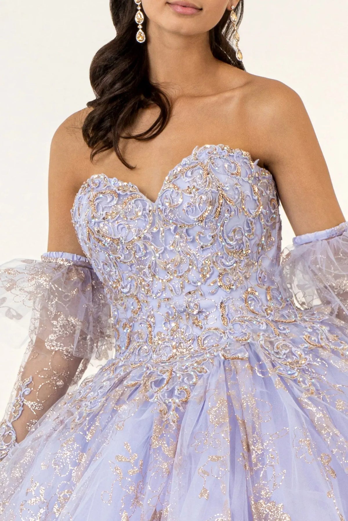 Bodice close-up highlights the Lilac quinceañera ball gown with glitter embroidery.