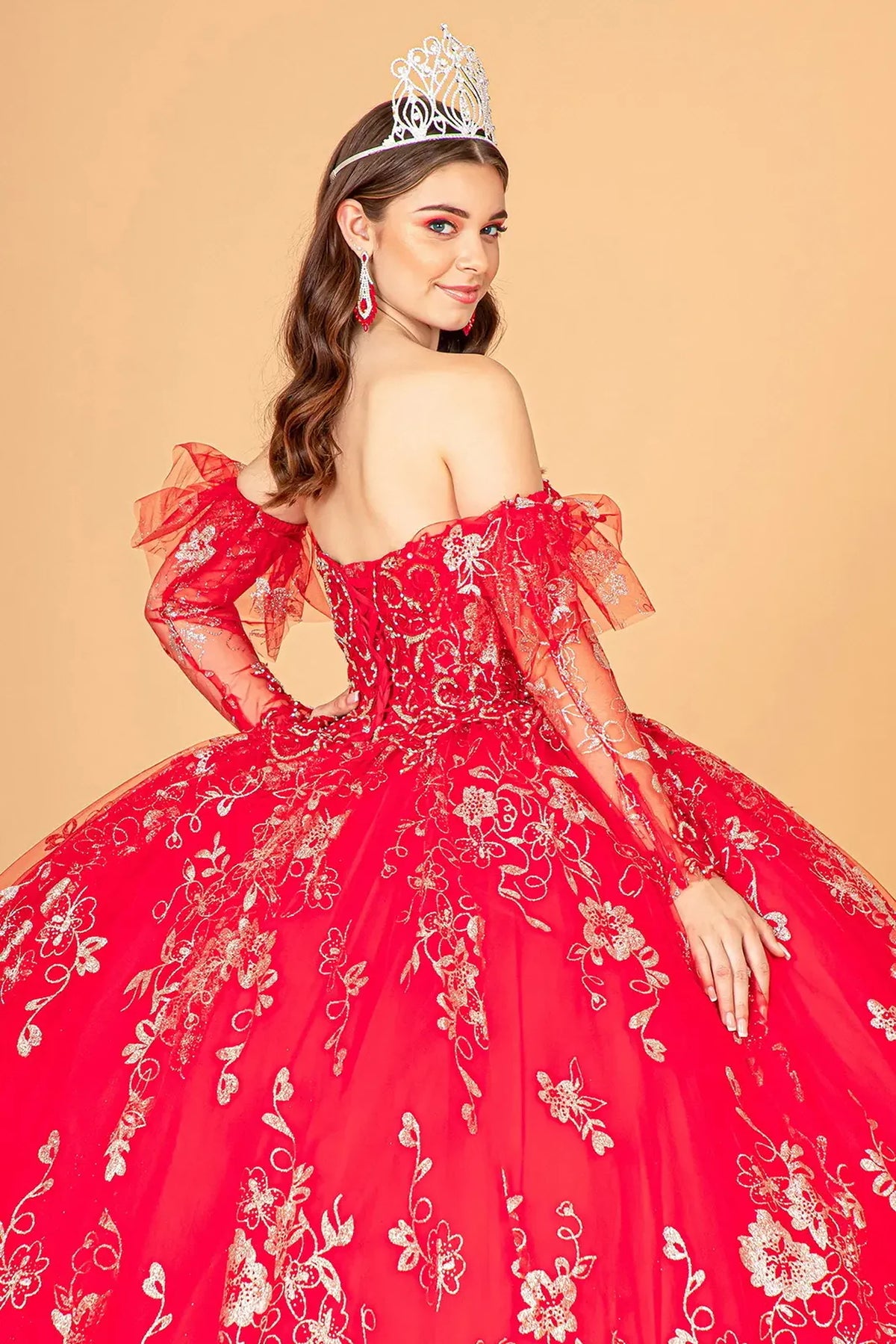 Bodice close-up highlights the Red quinceañera ball gown with glitter embroidery.