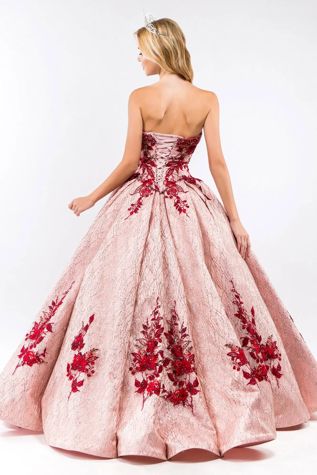Lace-up back reveals the Rose Gold quinceañera ball gown with lace-up back and jeweled embroidery.