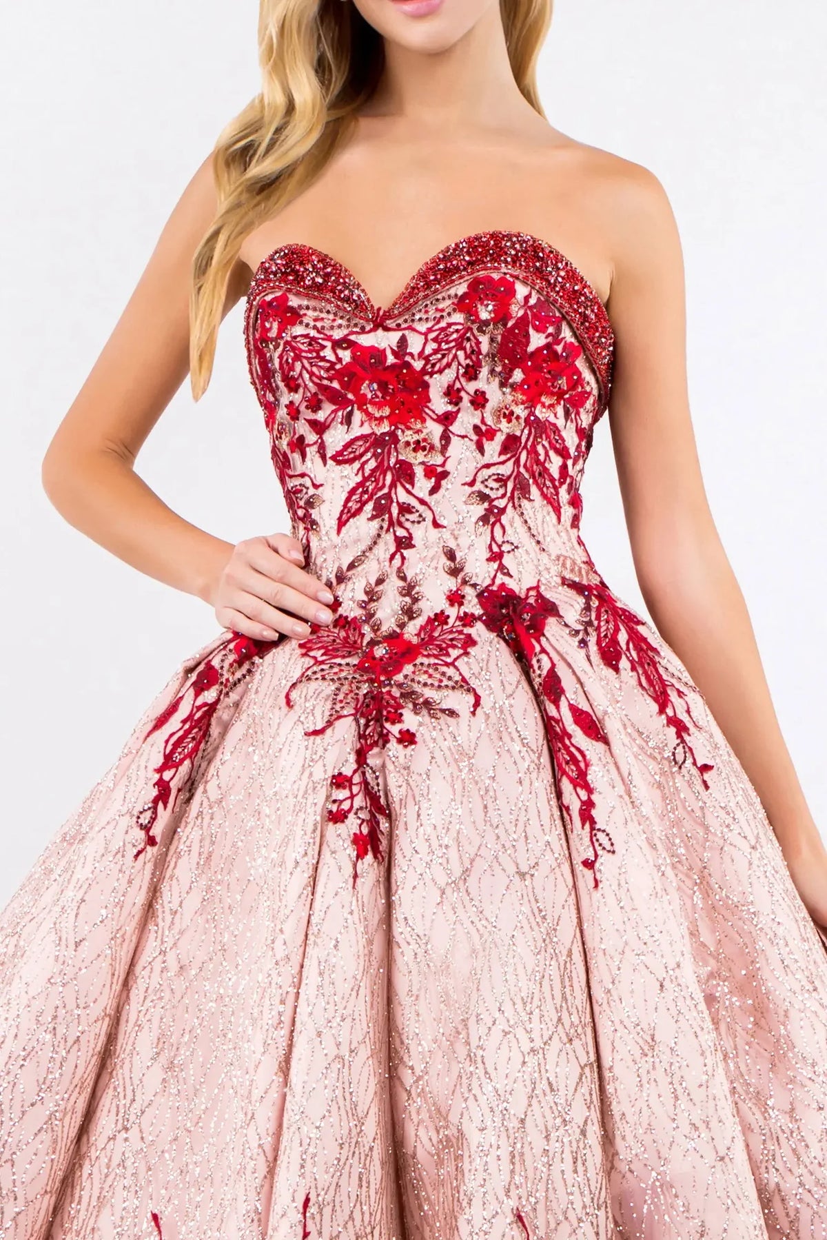 Bodice close-up highlights the Rose Gold quinceañera ball gown with jeweled embroidery.
