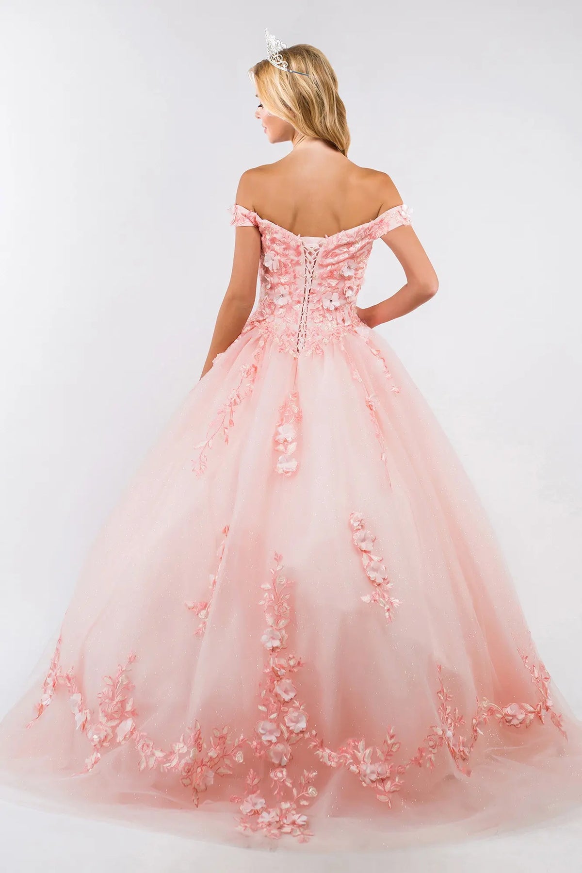 Lace-up back reveals the Blush quinceañera ball gown with lace-up back and cutaway shoulder detail.