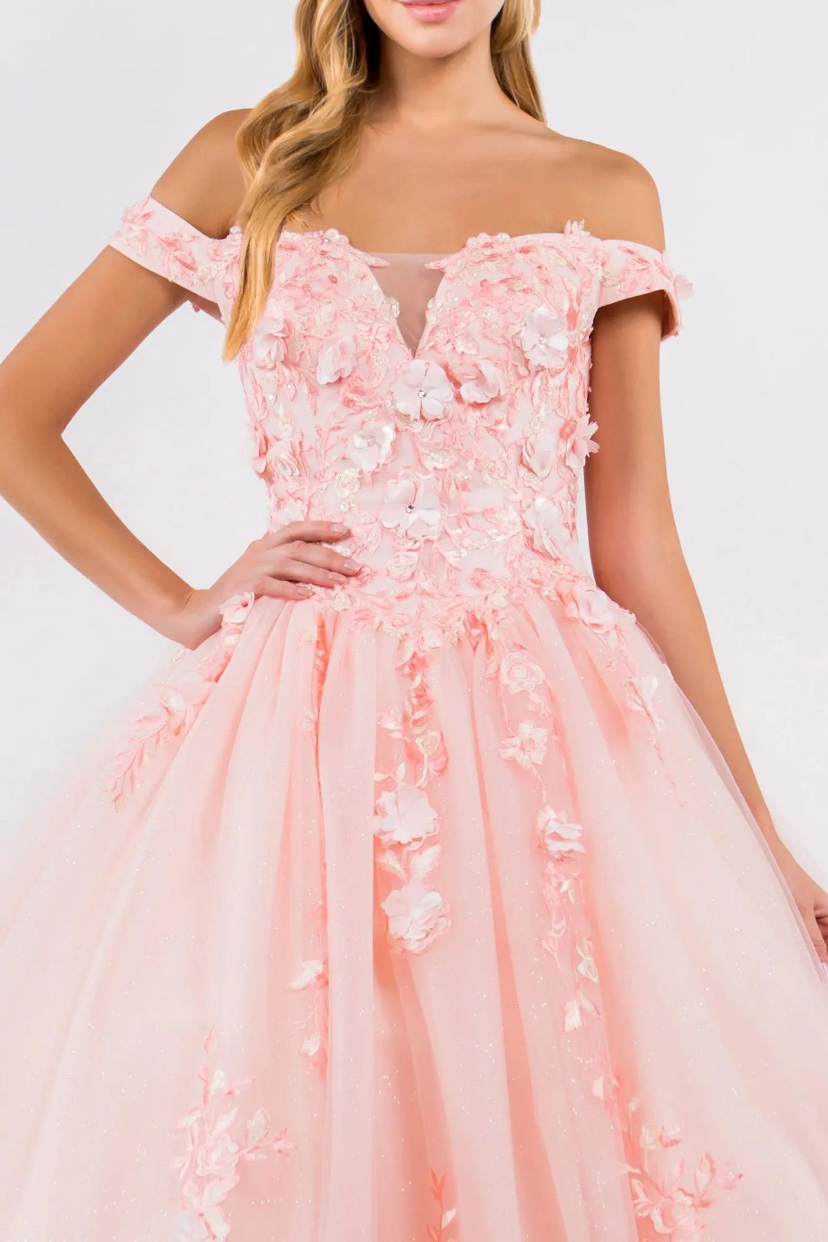 Bodice close-up highlights the Blush quinceañera ball gown with cutaway shoulder detail.