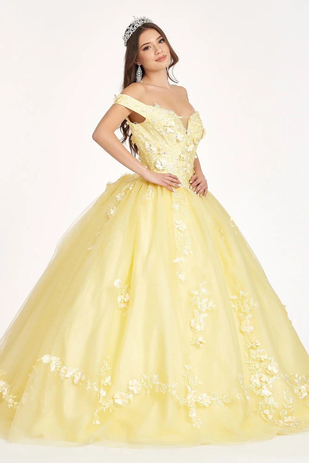 Lace-up back reveals the Yellow quinceañera ball gown with lace-up back and cutaway shoulder detail.