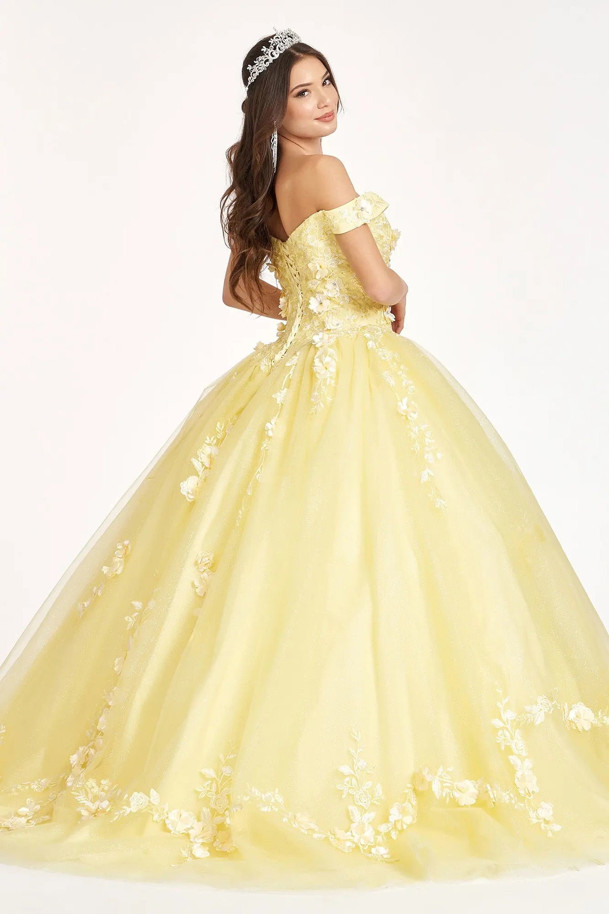 Bodice close-up highlights the Yellow quinceañera ball gown with cutaway shoulder detail.