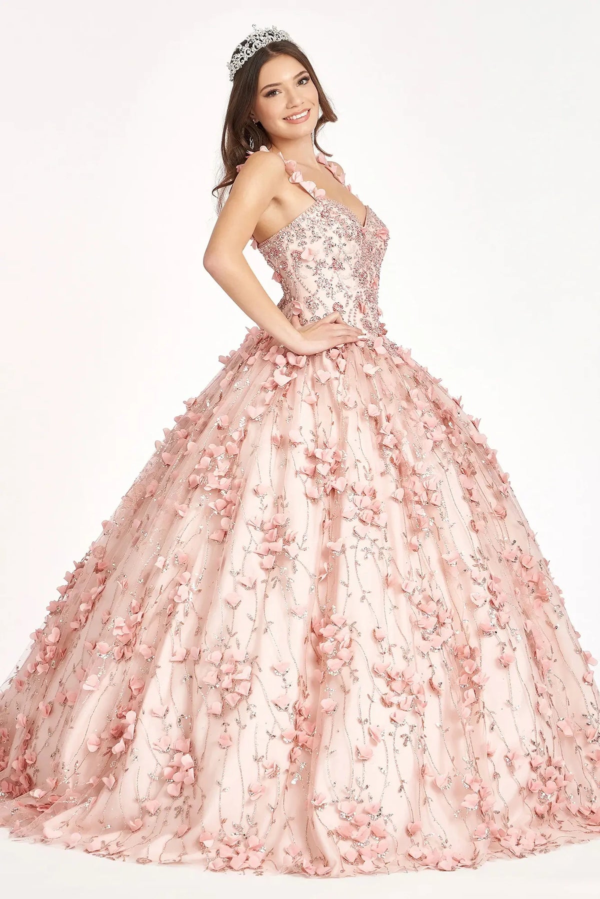 Lace-up back reveals the Blush quinceañera ball gown with lace-up back and jeweled spaghetti straps.