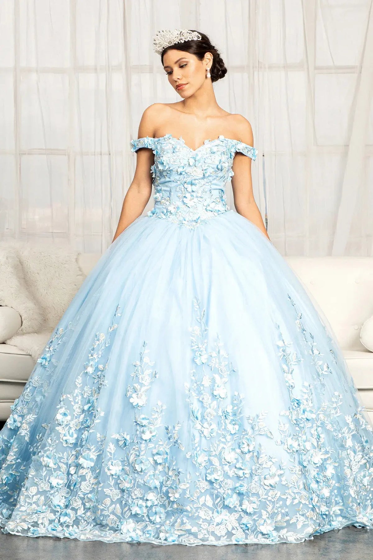 Lace-up back reveals the Baby Blue quinceañera ball gown with lace-up back and cutaway shoulder detail.