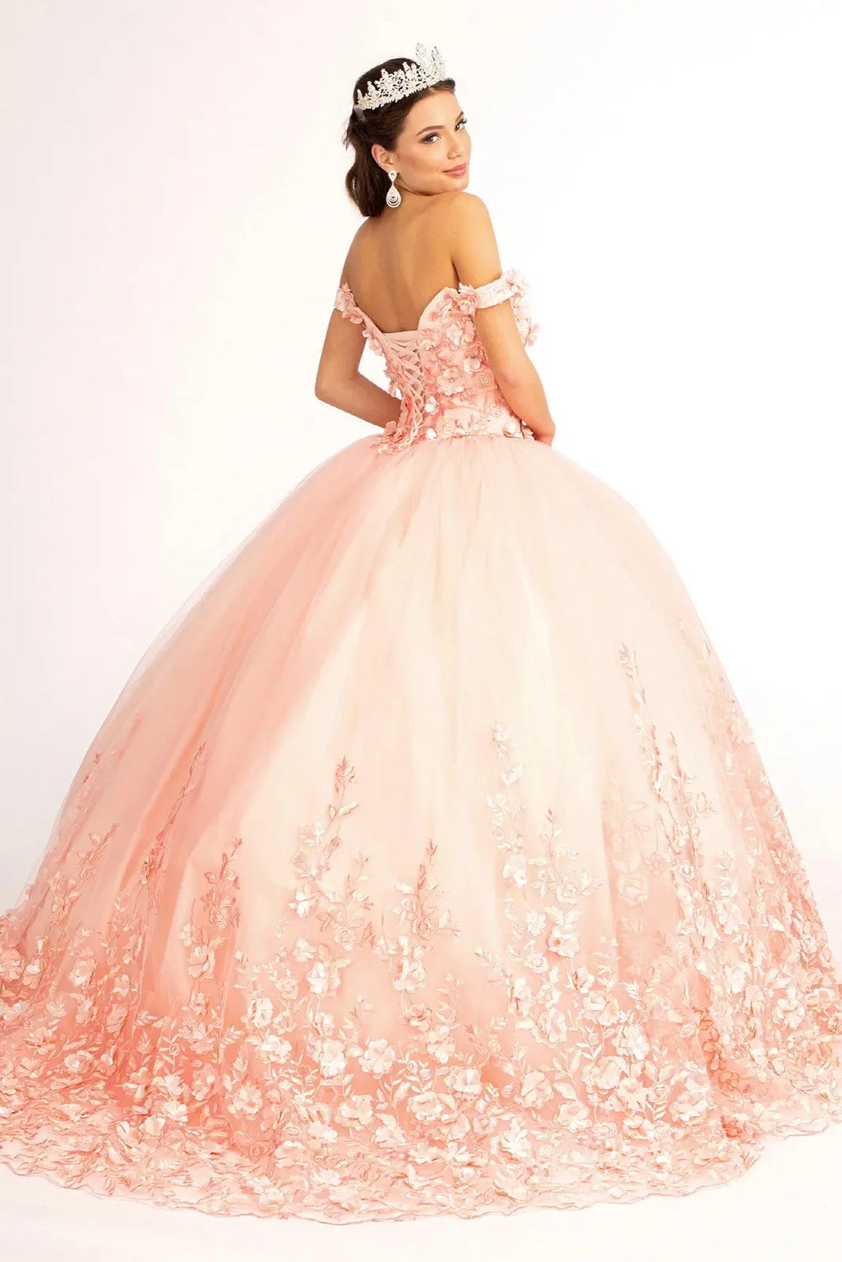 Bodice close-up highlights the Blush quinceañera ball gown with cutaway shoulder detail.