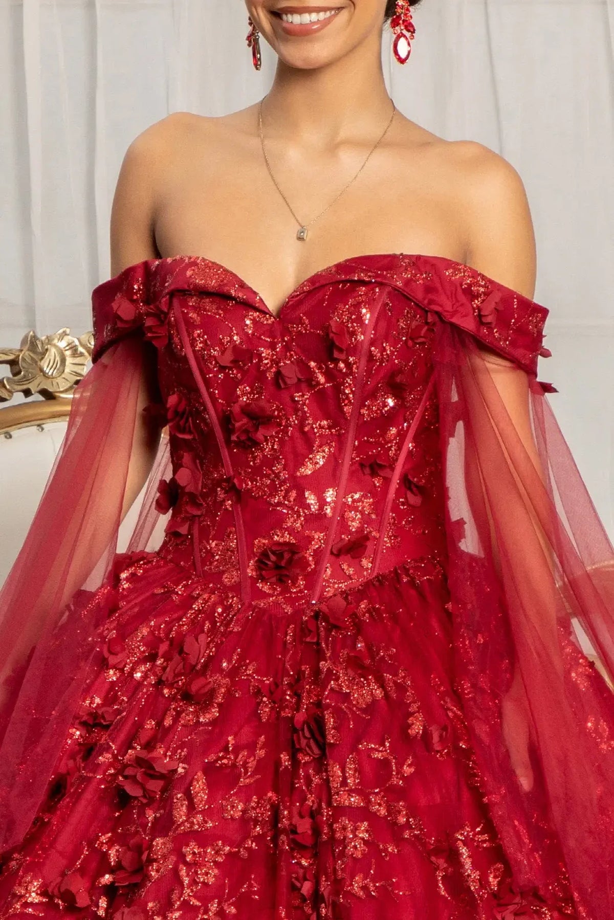 Full-length view presents the Burgundy quinceañera ball gown with 3d floral appliqués.