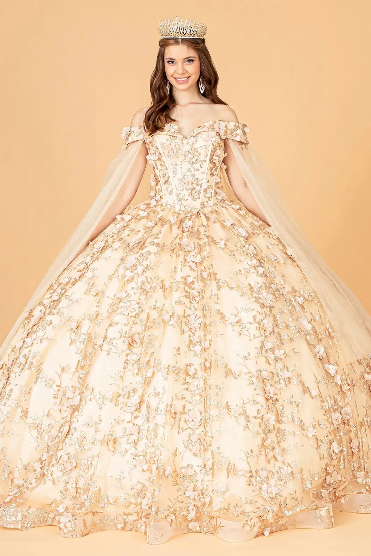 Lace-up back reveals the Champagne quinceañera ball gown with lace-up back and draped shoulder mesh.