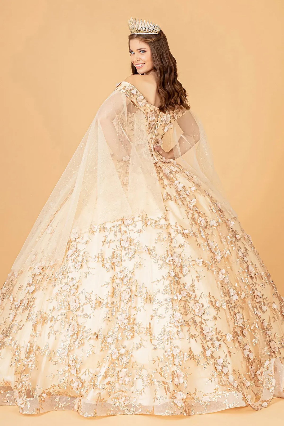 Bodice close-up highlights the Champagne quinceañera ball gown with draped shoulder mesh.
