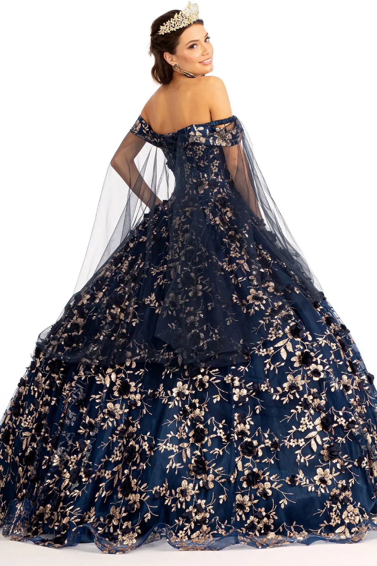 Bodice close-up highlights the Navy quinceañera ball gown with draped shoulder mesh.