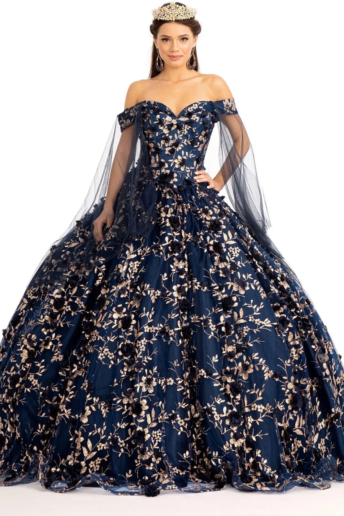 Embroidered details frame the Navy quinceañera ball gown with 3d floral appliqués.