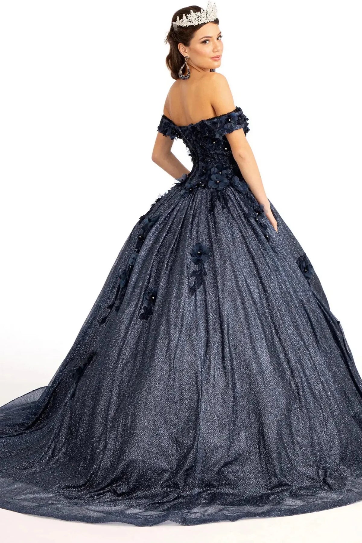 Bodice close-up highlights the Navy quinceañera ball gown with glitter mesh skirt.