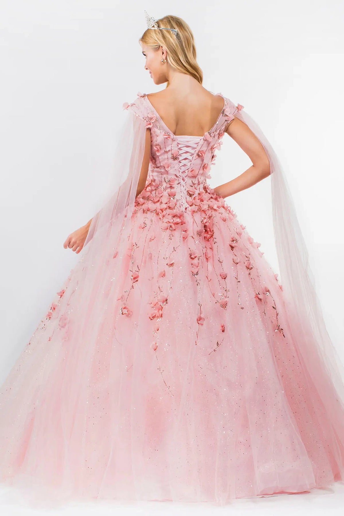 Lace-up back reveals the Blush quinceañera ball gown with lace-up back and 3d floral appliqués.