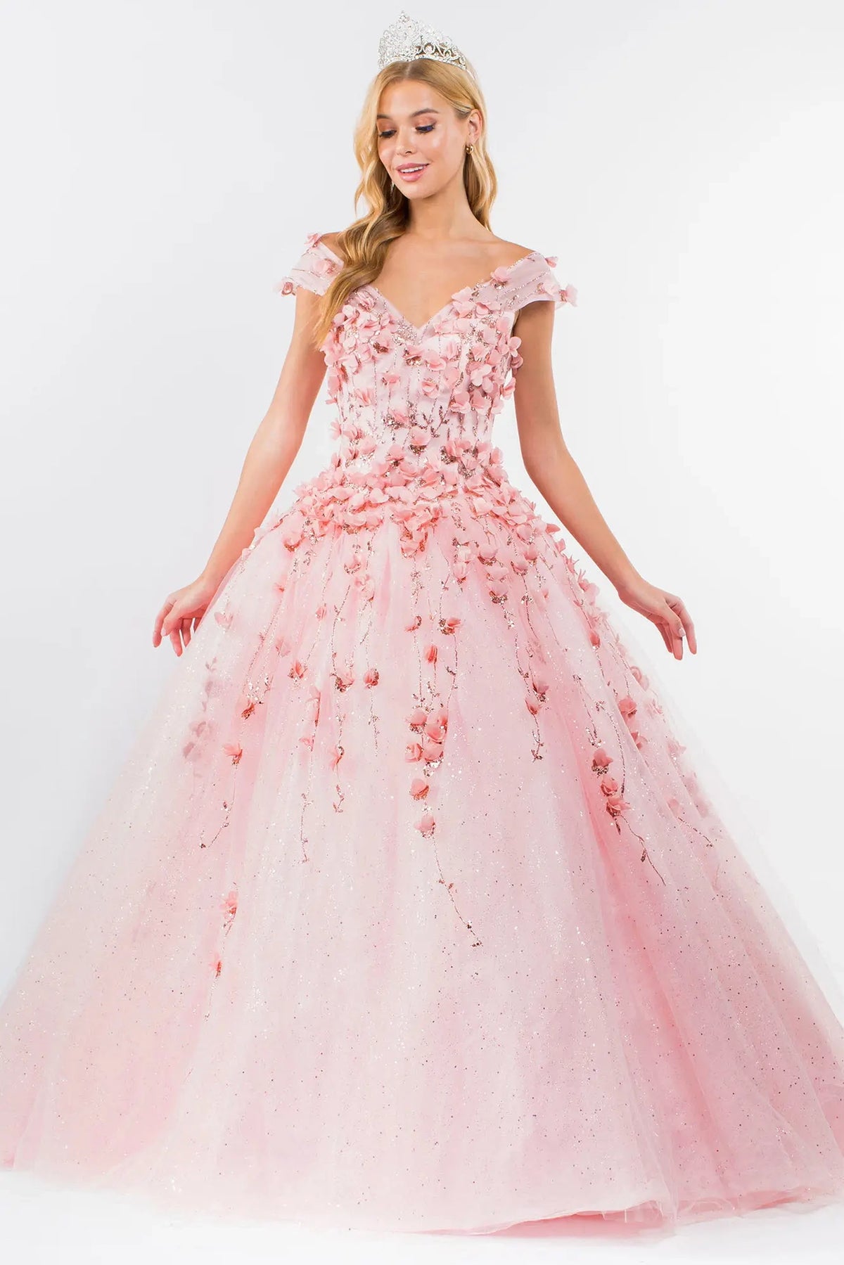 Embroidered details frame the Blush quinceañera ball gown with detachable cape sleeves.