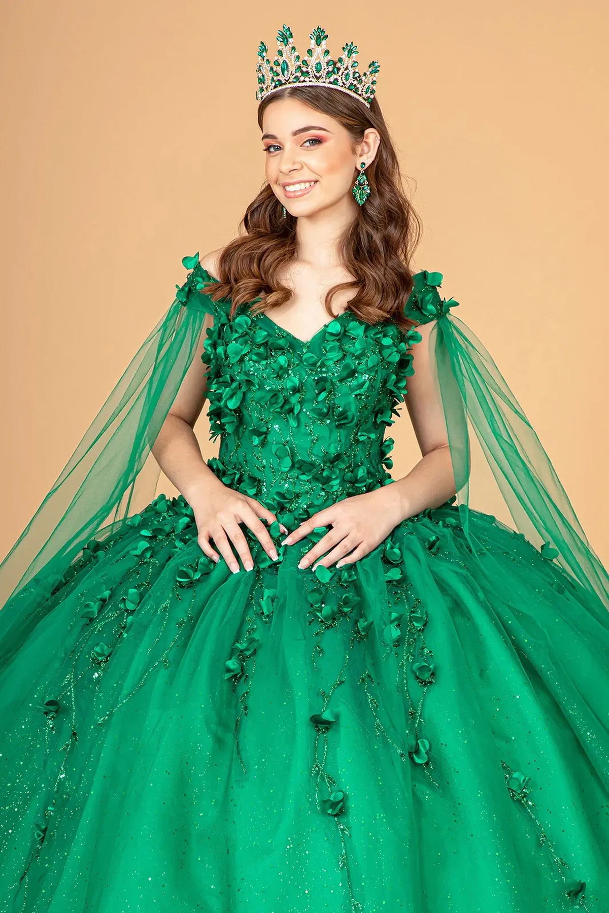Full-length view presents the Emerald Green quinceañera ball gown with detachable cape sleeves.
