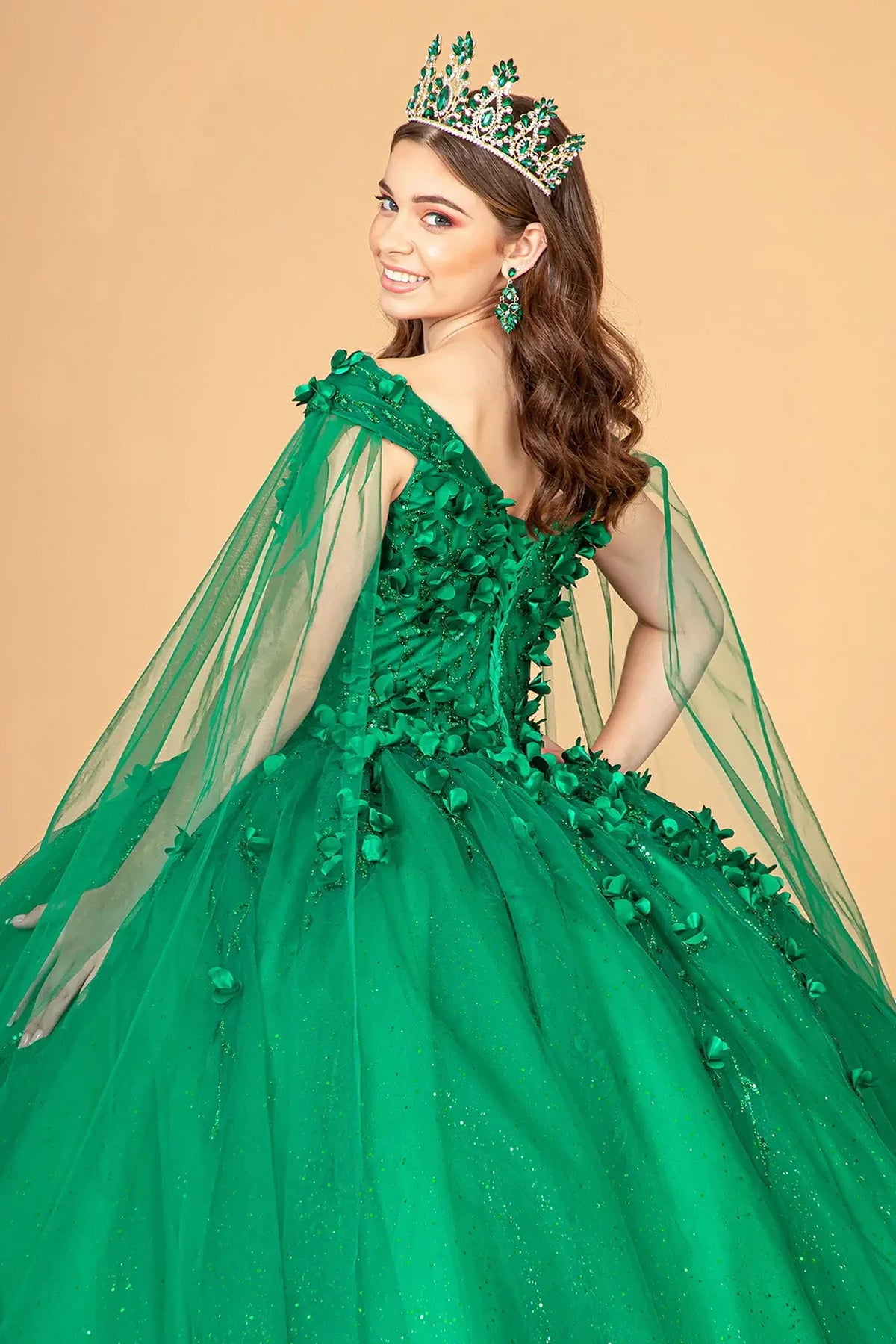 Bodice close-up highlights the Emerald Green quinceañera ball gown with 3d floral appliqués.