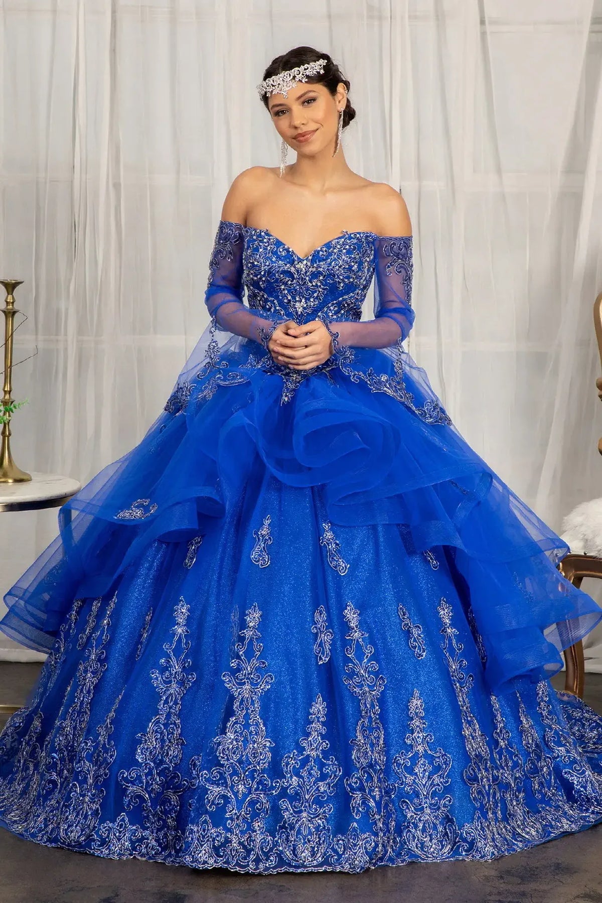 Lace-up back reveals the Royal Blue quinceañera ball gown with lace-up back and glitter embroidery.