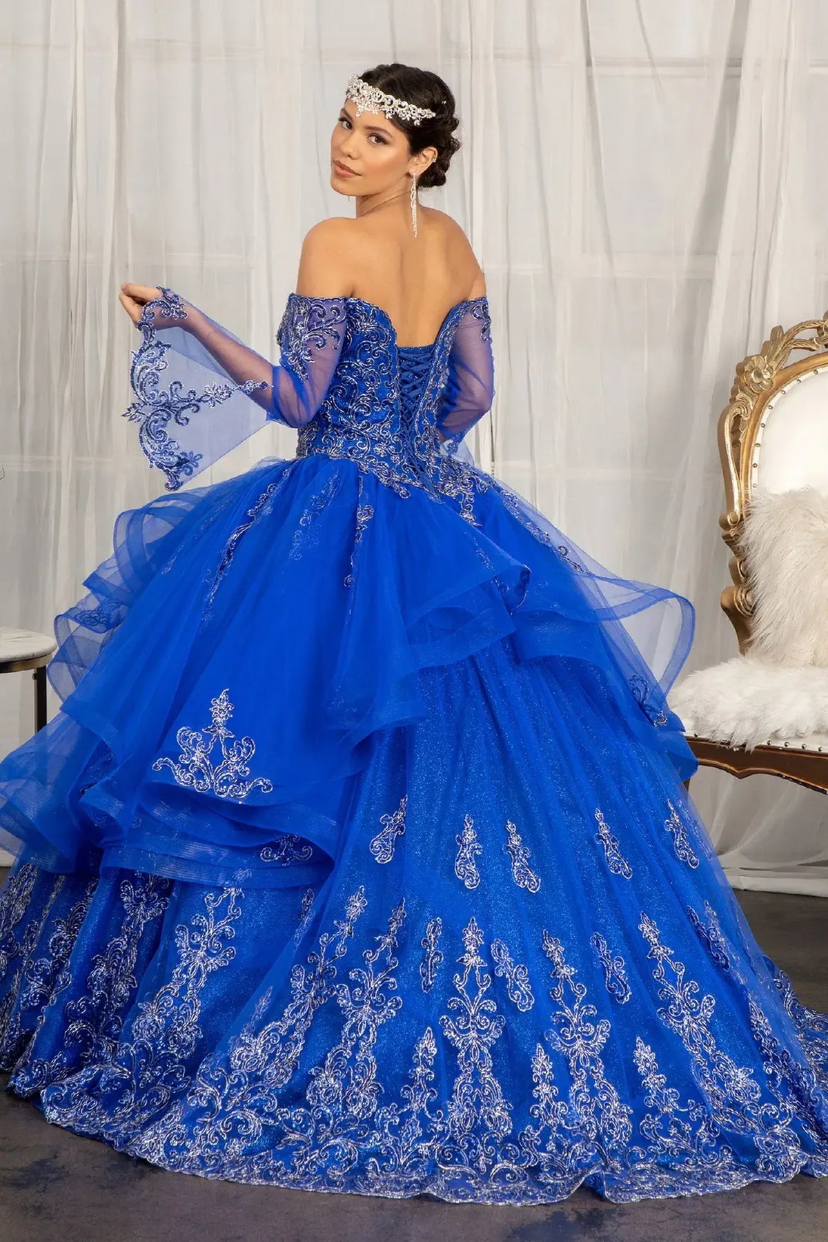 Bodice close-up highlights the Royal Blue quinceañera ball gown with glitter embroidery.