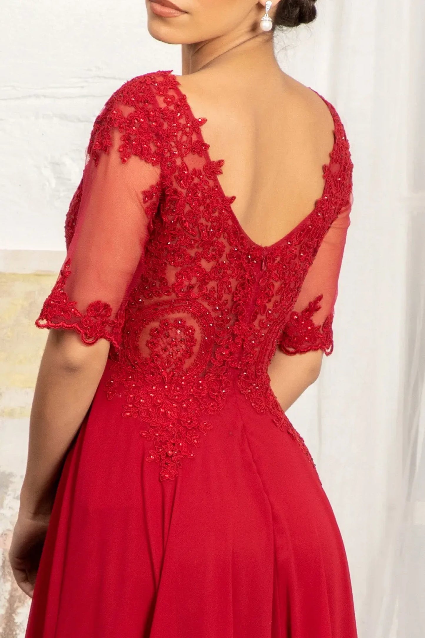 Burgundy mother of the bride dress featuring v-back with concealed zipper bodice finished with rhinestones, embroidery, jewels, appliqués