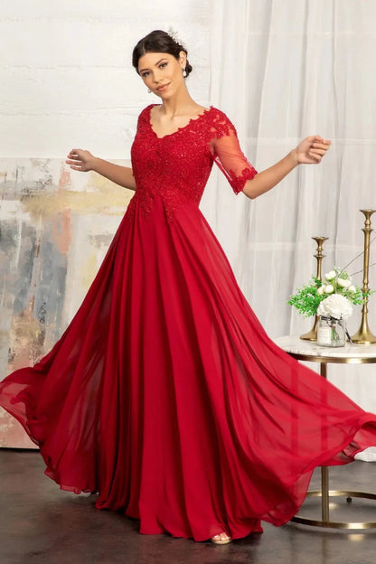 Detailed view highlights burgundy mother of the bride dress featuring chiffon skirt with a-line shaping and rhinestones, embroidery.