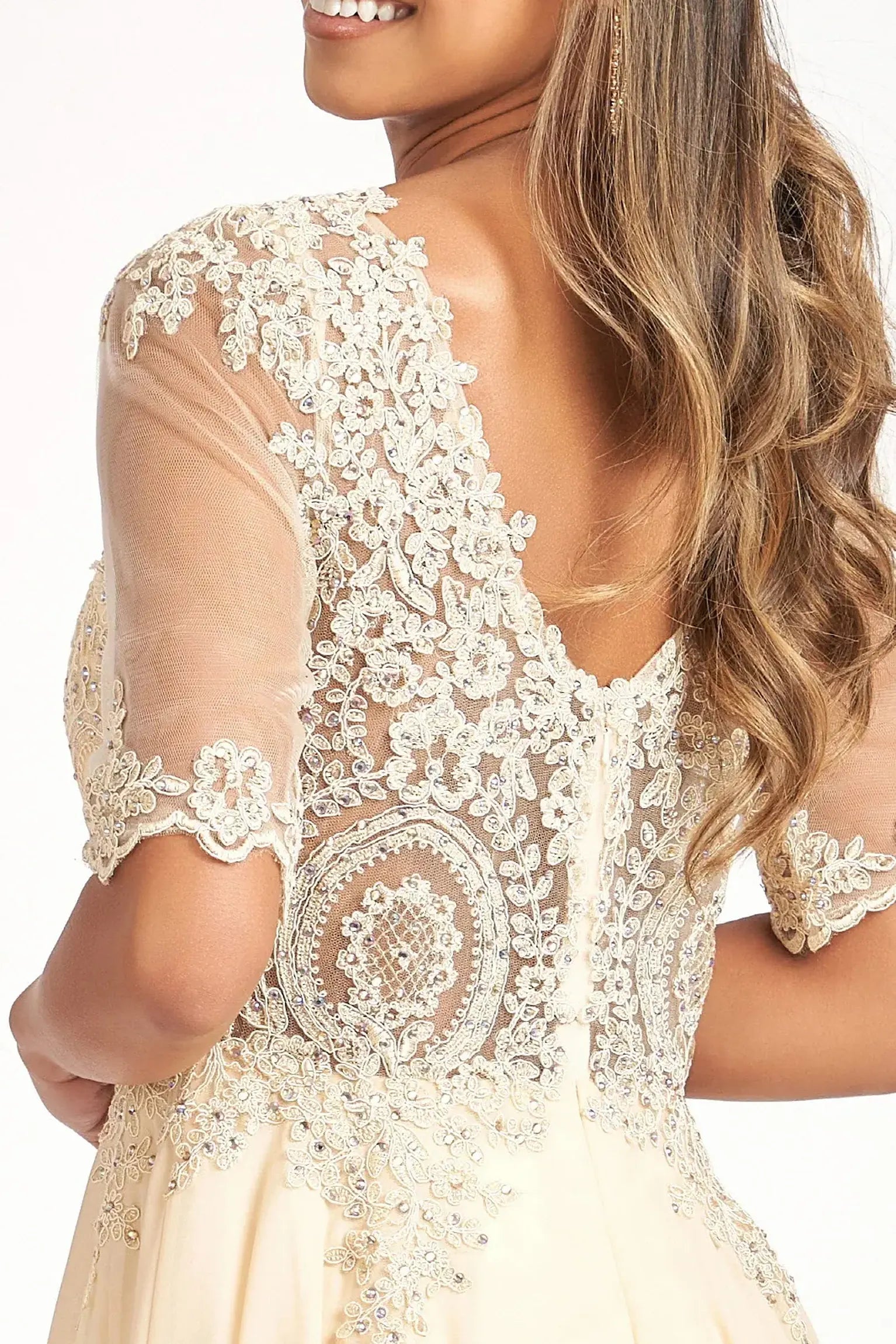 Champagne mother of the bride dress featuring v-back with concealed zipper bodice finished with rhinestones, embroidery, jewels, appliqués