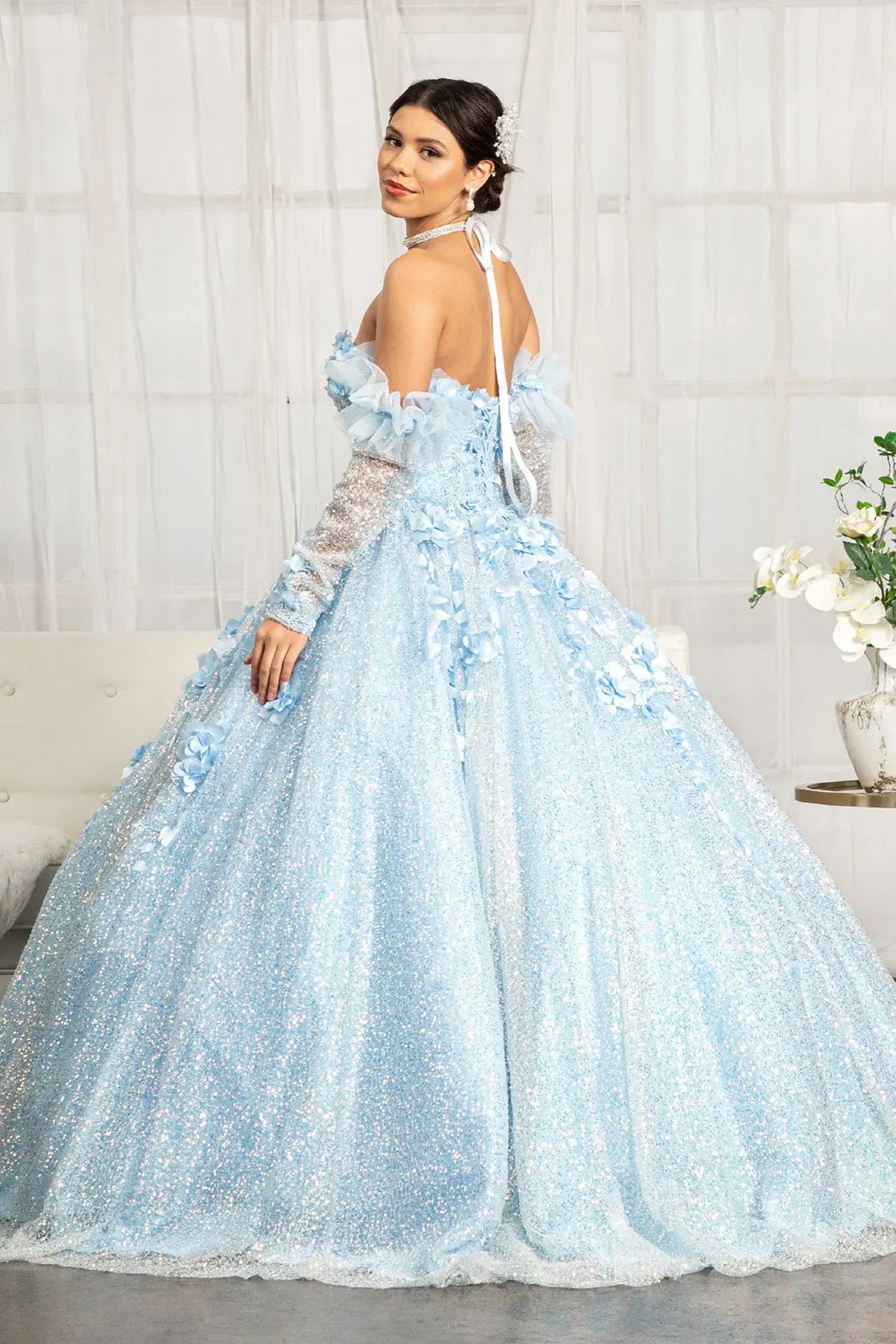 Bodice close-up highlights the Baby Blue quinceañera ball gown with detachable long sleeves.