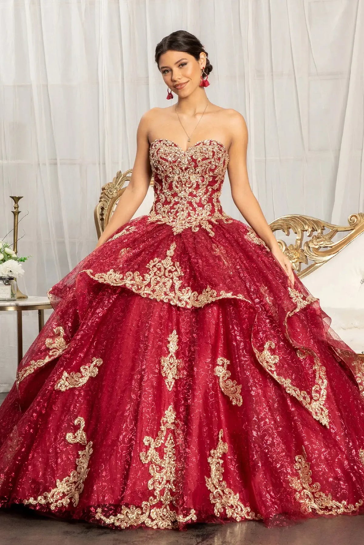 Lace-up back reveals the Burgundy quinceañera ball gown with lace-up back and embroidered mesh skirt.