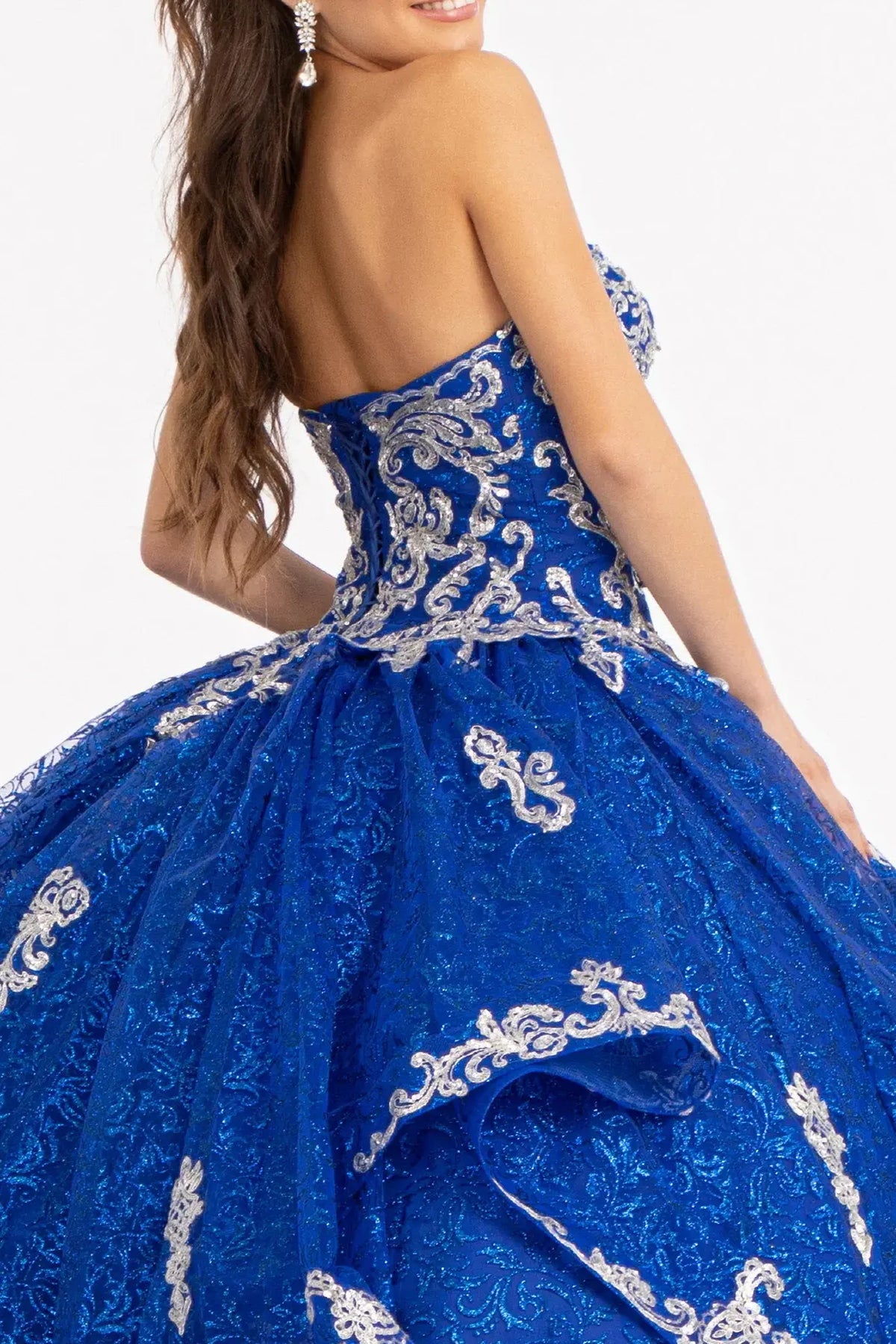 Embroidered details frame the Royal Blue quinceañera ball gown with sequin pattern.
