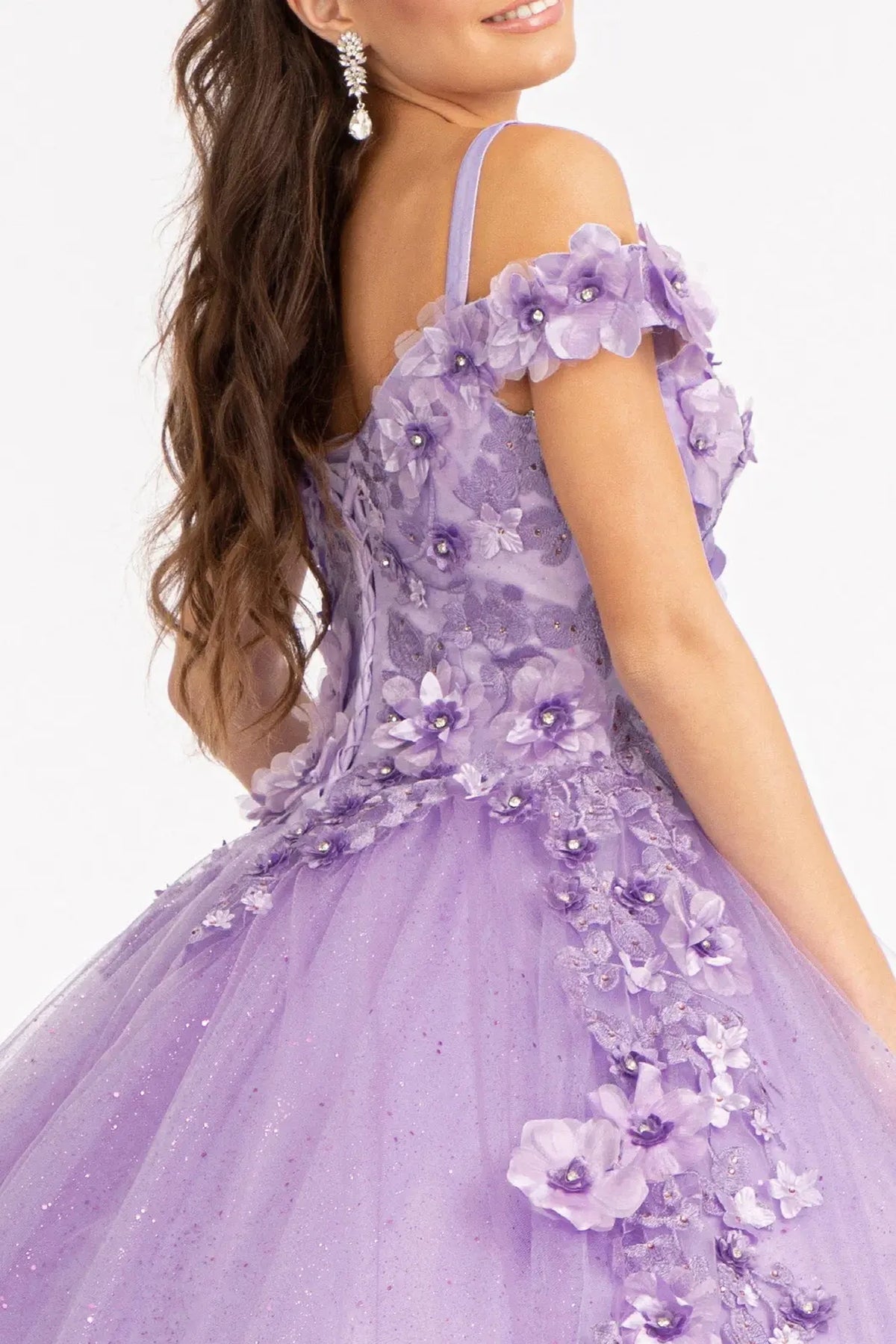 Embroidered details frame the Lilac quinceañera ball gown with 3d floral appliqués.