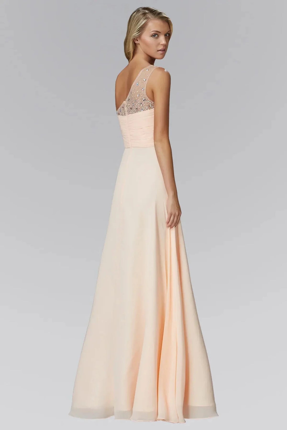 Rear view highlights the open back of the Peach prom evening dress.