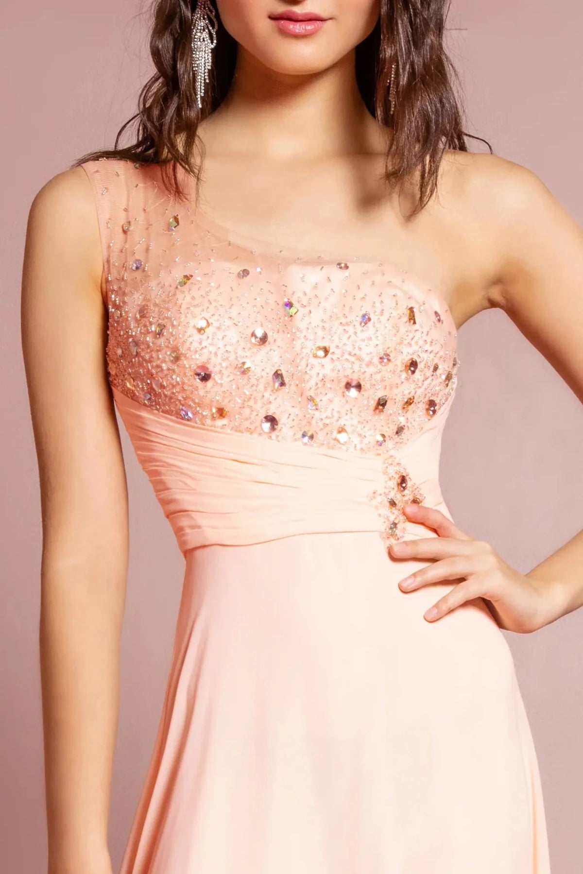 Bodice close-up reveals beadwork and jewel accents across the asymmetric upper bodice of the Peach prom evening dress.