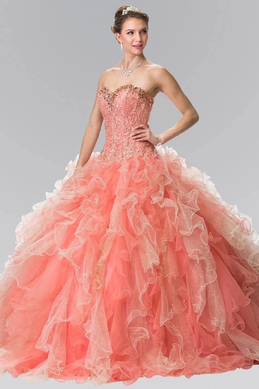 The Coral/Champagne quinceañera ball gown appears head to toe with a gold sweetheart bodice and coral organza ruffles.