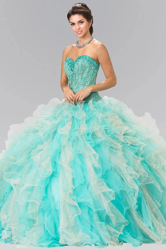 Sweeping Tiffany/Champagne quinceañera ball gown is shown in full with a sheer bolero over a gold-patterned bodice and aqua ruffles.