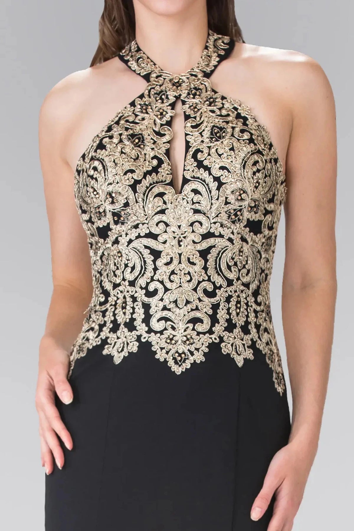 Mermaid shaping defines the skirt of the Black prom evening dress.