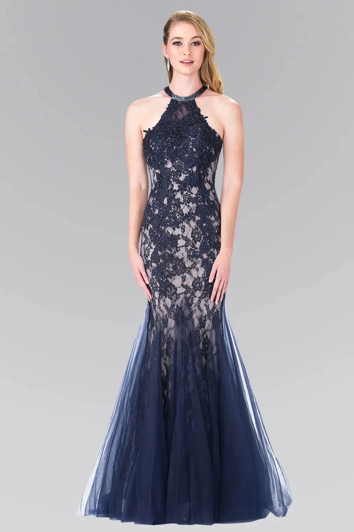 Full-length front view shows embroidered halter styling on the Navy prom evening dress.