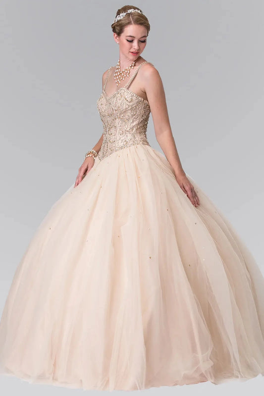 Displayed in full, the Champagne quinceañera ball gown features a beaded sweetheart bodice and softly gathered tulle skirt.