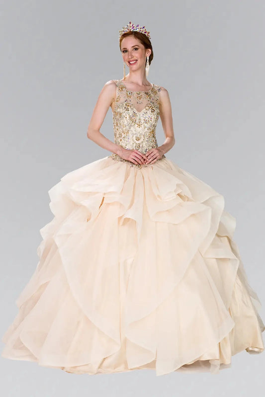 Sweeping Champagne quinceañera ball gown is shown in full with a jeweled illusion neckline and champagne waterfall ruffles.