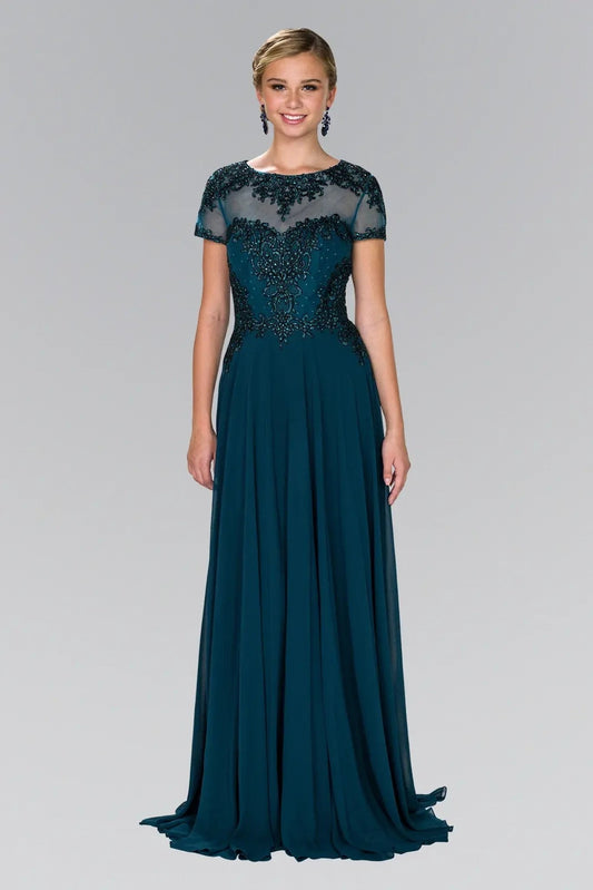 Full-length view highlights teal beading embroidery formal dress.