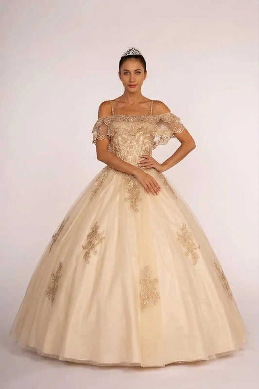 The Champagne quinceañera ball gown appears head to toe with an off-shoulder lace ruffle and gold appliqué ball skirt.