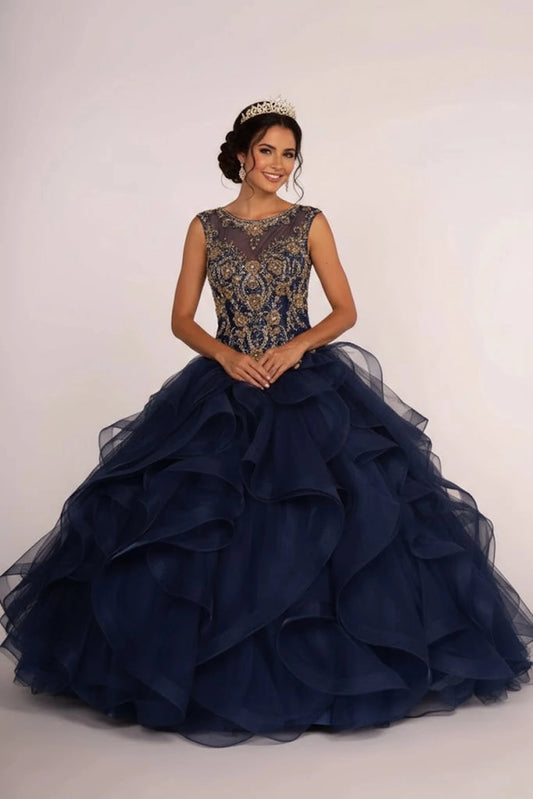 Full-length Navy quinceañera ball gown showcases a gold jeweled bodice and sweeping navy tiered ruffles.