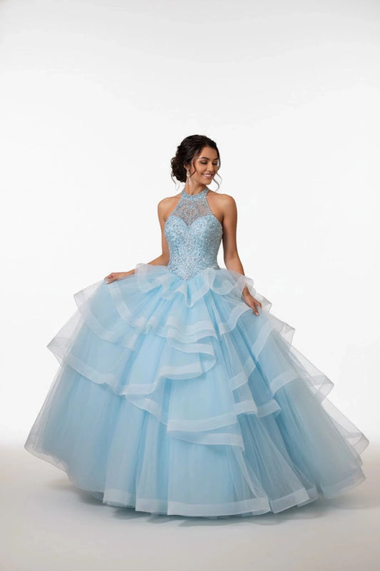 Sweeping Sky quinceañera ball gown is shown in full with a jeweled halter bodice and asymmetrical sky-blue ruffles.
