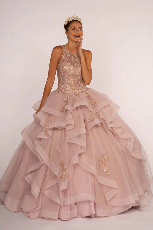 The Mauve quinceañera ball gown appears head to toe with a jeweled halter bodice and layered mauve ruffle skirt.