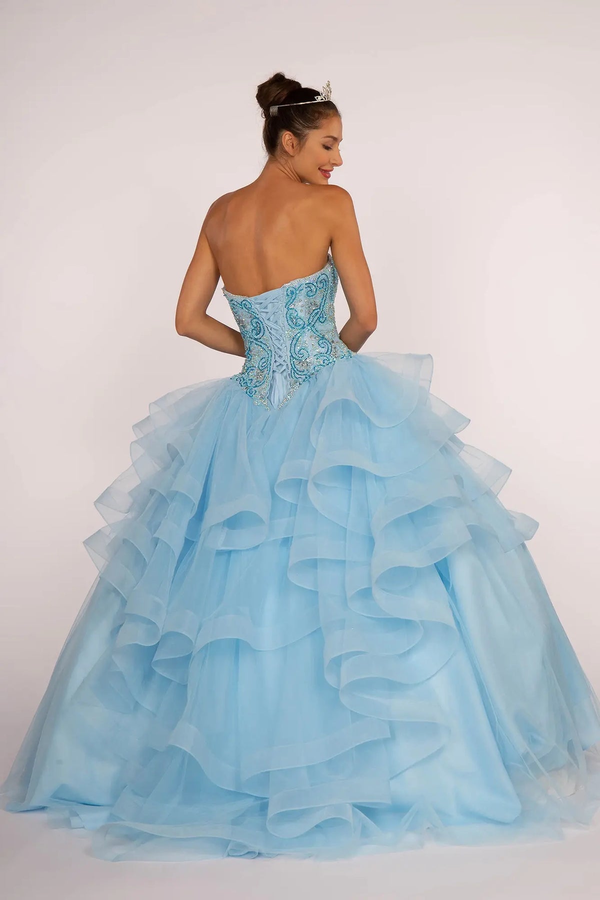 Lace-up back reveals the Sky quinceañera ball gown with lace-up back and ruffled tulle skirt.