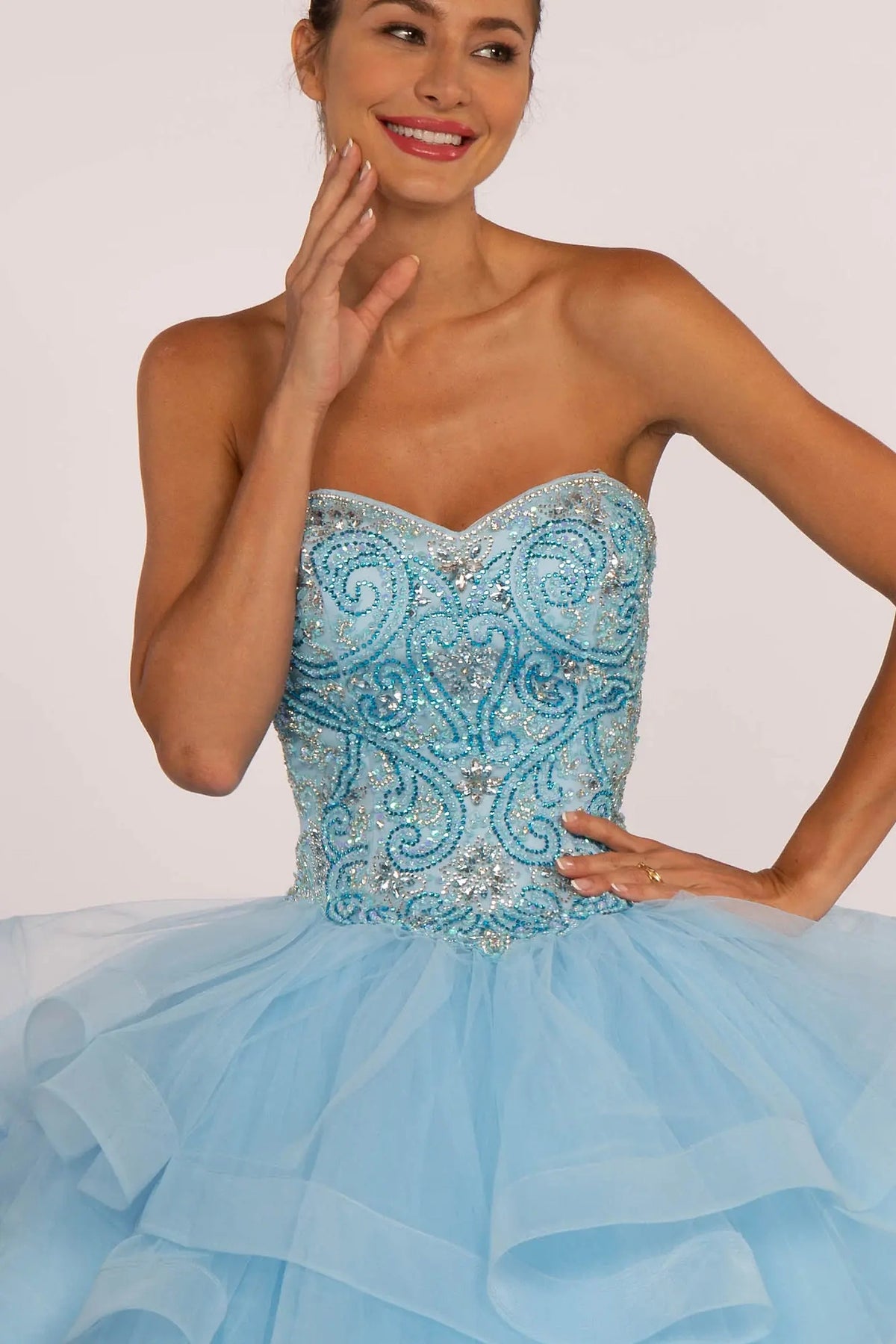 Bodice close-up highlights the Sky quinceañera ball gown with ruffled tulle skirt.