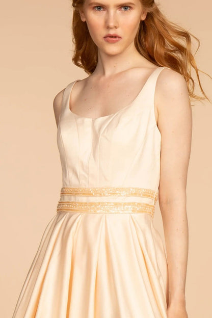 Bodice close-up highlights champagne beading embroidery floral formal dress.
