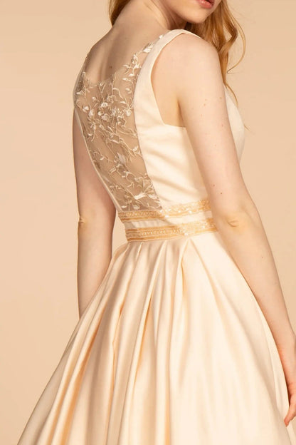 Full-length view highlights champagne beading embroidery floral formal dress.